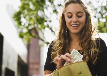 Teen removing money from wallet